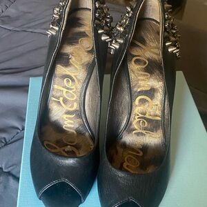 Black peep toe heels. See 3rd pic missing stone on right shoe heel.